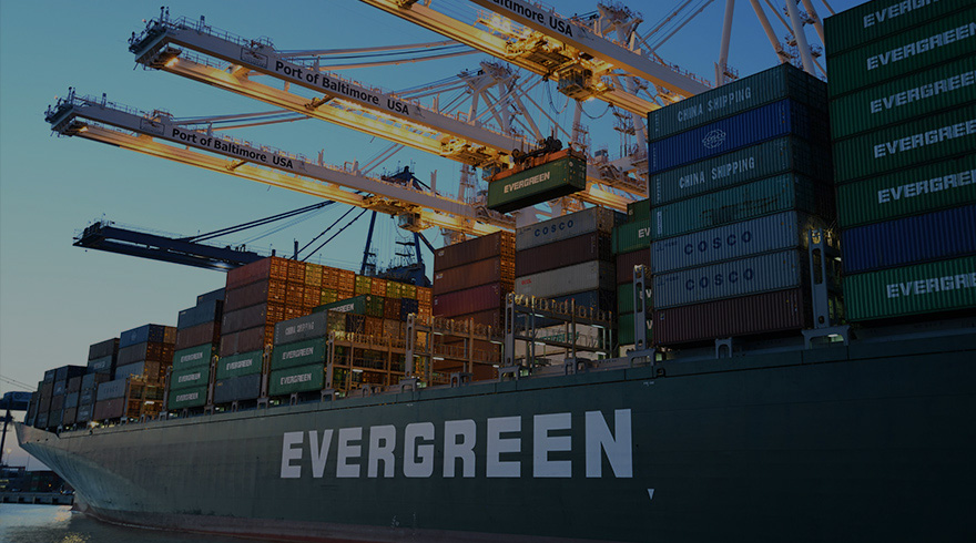 Evergreen ship carries containers at port of Baltimore, USA.